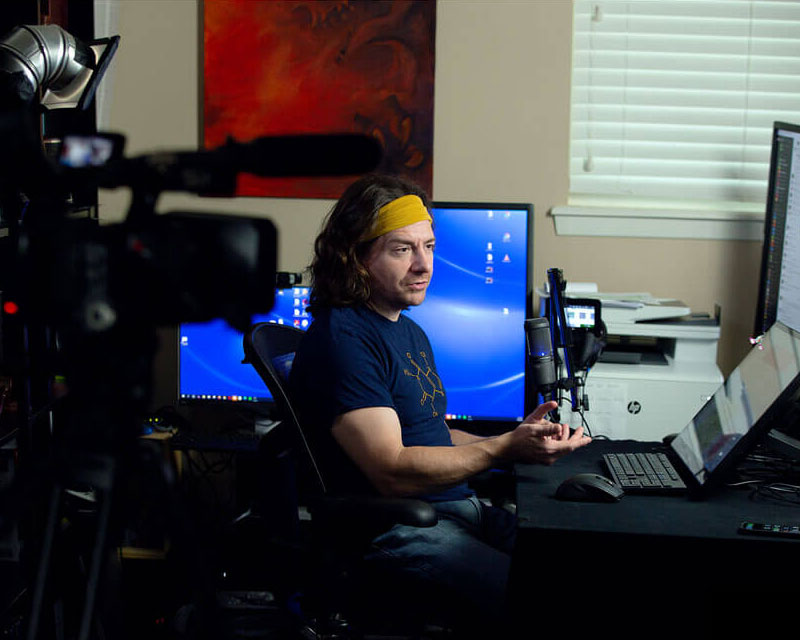 David Maples, host of The Buck Stops Here, at his desk recording